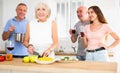 Happy family is preparing a festive dinner in the kitchen