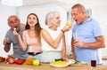 Happy family is preparing a festive dinner in the kitchen