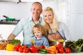 Happy family preparing a healthy dinner at home. Royalty Free Stock Photo