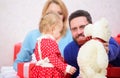Happy family with present box. Love and trust in family. Bearded man and woman with little girl. father, mother and
