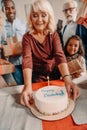 happy family presenting birthday cake Royalty Free Stock Photo