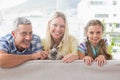 Happy family with rabbit on sofa at home Royalty Free Stock Photo