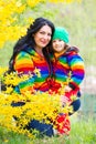 Happy family in rainbow hoodies