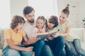 Happy family read interesting book wear in denim, jeans outfit w