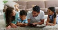 Happy family reading book in living room