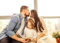 happy family reading a book to her daughter. Royalty Free Stock Photo