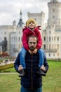 Happy family, relaxing in the park in front of beautiful renaissance castle Hluboka Royalty Free Stock Photo