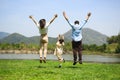 Happy family relaxing and playing outdoor together in park on weekend Royalty Free Stock Photo