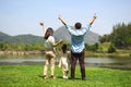 Happy family relaxing and playing outdoor together in park on weekend Royalty Free Stock Photo