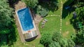 Happy family relaxing by swimming pool, aerial drone view from above of parents and kids have fun on vacation, family weekend Royalty Free Stock Photo