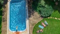 Happy family relaxing by swimming pool, aerial drone view from above of parents and kids have fun on vacation, family weekend Royalty Free Stock Photo