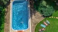 Happy family relaxing by swimming pool, aerial drone view from above of parents and kids have fun on vacation, family weekend Royalty Free Stock Photo