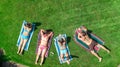 Happy family relaxing by swimming pool, aerial drone view from above of parents and kids have fun on vacation, family weekend Royalty Free Stock Photo