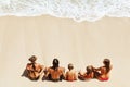 Happy family relaxing on white sand sea beach Royalty Free Stock Photo