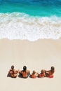 Happy family relaxing on white sand sea beach Royalty Free Stock Photo