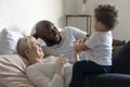 Happy family resting at home, a multicultural family