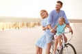 Happy family riding bicycle outdoors Royalty Free Stock Photo