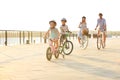 Happy family riding bicycles outdoors Royalty Free Stock Photo