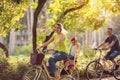 Happy family is riding bikes outdoors and smiling- Boy on bike w