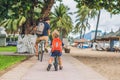 Happy family is riding bikes outdoors and smiling. Father on a b Royalty Free Stock Photo