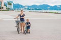 Happy family is riding bikes outdoors and smiling. Mom on a bike Royalty Free Stock Photo