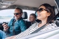 Happy family riding in a car