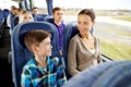 Happy family riding in travel bus Royalty Free Stock Photo