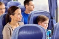 Happy family riding in travel bus Royalty Free Stock Photo