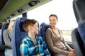 Happy family riding in travel bus Royalty Free Stock Photo