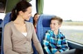 Happy family riding in travel bus Royalty Free Stock Photo