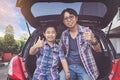 Happy family on a road trip, Sitting In Trunk Of Car Royalty Free Stock Photo