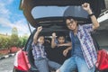 Happy family on a road trip, Sitting In Trunk Of Car Royalty Free Stock Photo