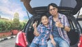 Happy family on a road trip, Sitting In Trunk Of Car Royalty Free Stock Photo