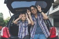 Happy family on a road trip, Sitting In Trunk Of Car Royalty Free Stock Photo