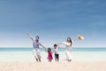 Happy family running at beach Royalty Free Stock Photo