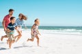 Happy family running on beach Royalty Free Stock Photo