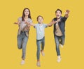 Happy family running forward and try to catch it Royalty Free Stock Photo