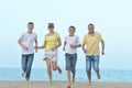 Happy family running on the sea beach background Royalty Free Stock Photo