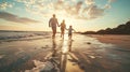 Happy family running together on the beach in holiday. Silhouette of the family holding hands enjoying the sunset Royalty Free Stock Photo