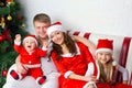 Happy family in Santa costumes Royalty Free Stock Photo
