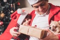 Happy family father and child giving Christmas gift at home Royalty Free Stock Photo