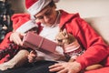 Happy family father and child giving Christmas gift at home Royalty Free Stock Photo