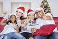 Happy family with Santa hat show thumbs up Royalty Free Stock Photo