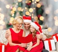 Happy family in santa helper hats with gift boxes Royalty Free Stock Photo