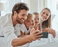 Happy family, selfie and smartphone in bedroom together for love, care or relax in family home in morning. Smile parents Royalty Free Stock Photo