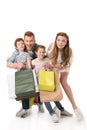 happy young family with two children holding paper bags Royalty Free Stock Photo