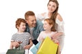 happy young family with two children holding shopping bags Royalty Free Stock Photo