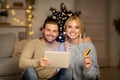 Happy family shopping online, using digital tablet and credit card