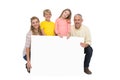 Happy family showing white card Royalty Free Stock Photo
