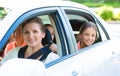 Happy family sitting in a car